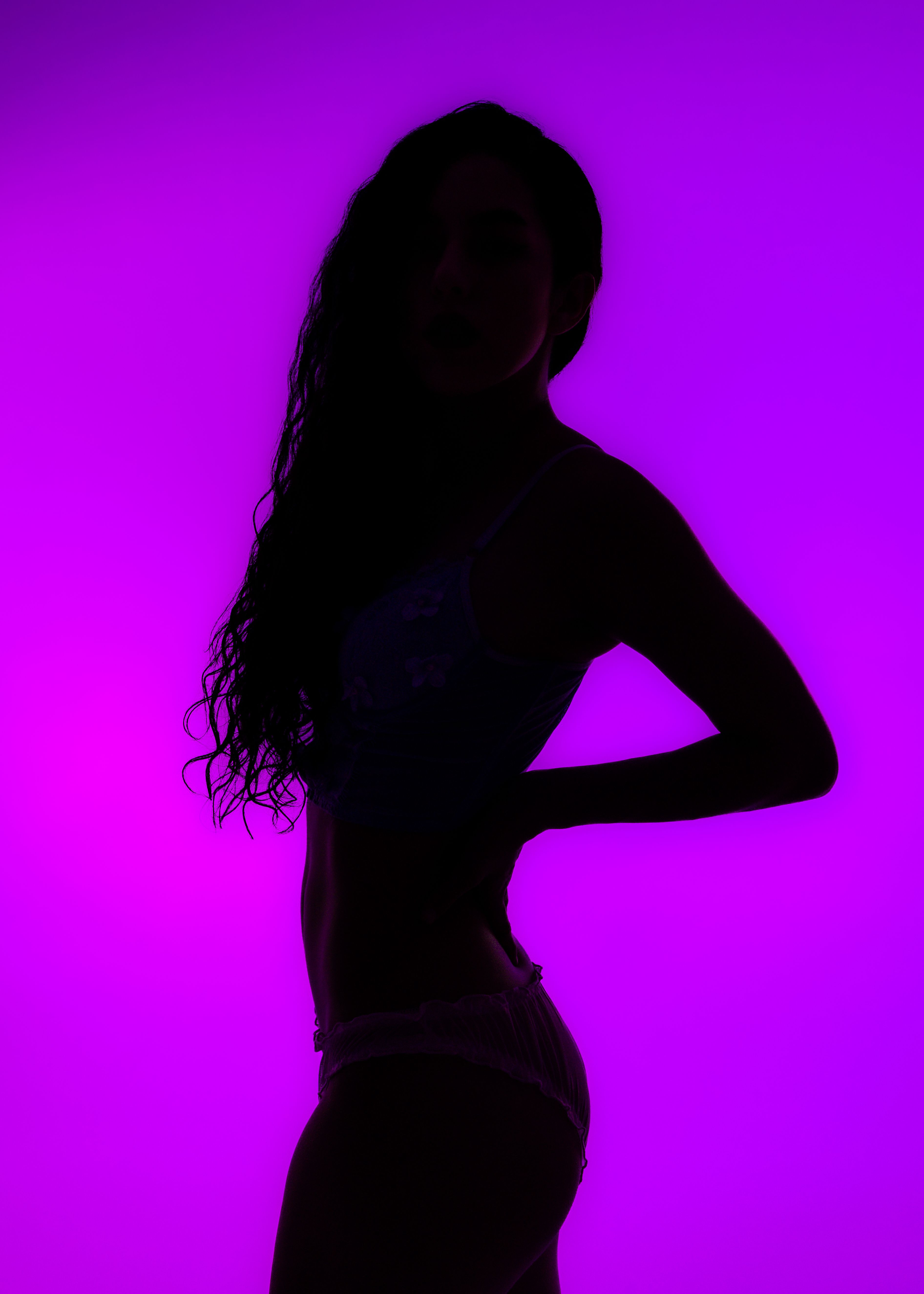 Placeholder editorial portrait in moody purple lighting